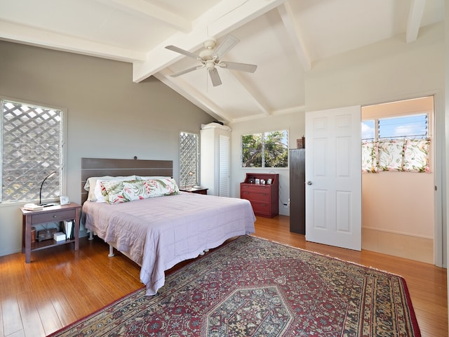 bedroom featuring vaulted ceiling with beams, wood-type flooring, and ceiling fan