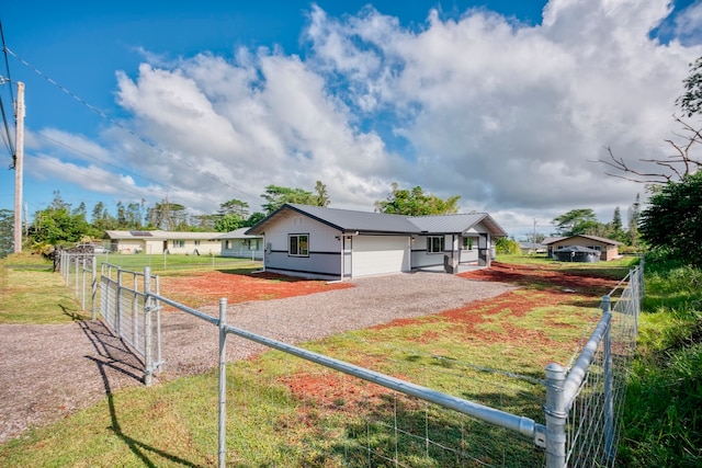 exterior space with a garage and a front lawn