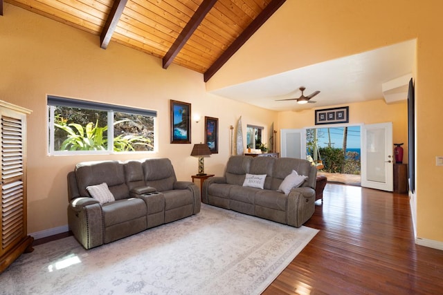 living room with beam ceiling, a wealth of natural light, ceiling fan, and wood ceiling