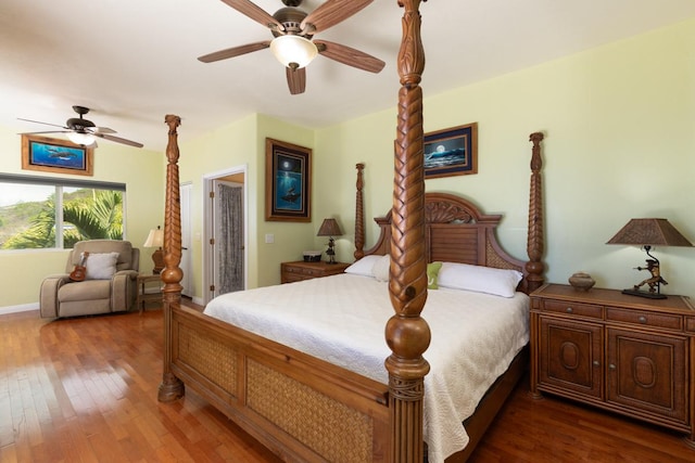 bedroom featuring ceiling fan and dark hardwood / wood-style flooring