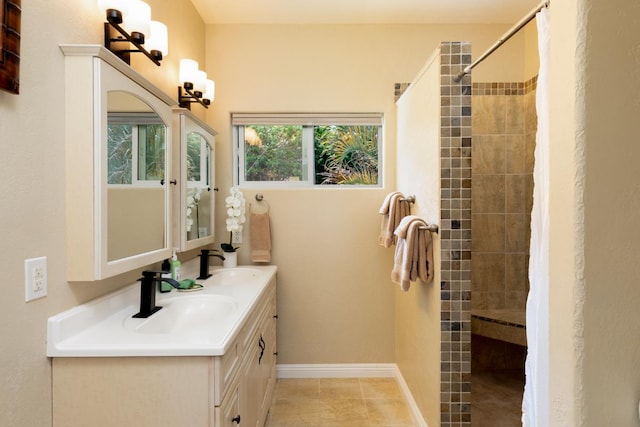 bathroom featuring vanity and curtained shower