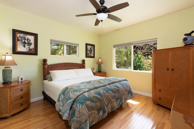 bedroom with light hardwood / wood-style flooring and ceiling fan