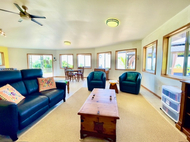 living room featuring light carpet and ceiling fan