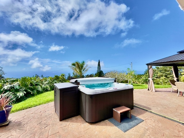 view of patio with a gazebo and a hot tub