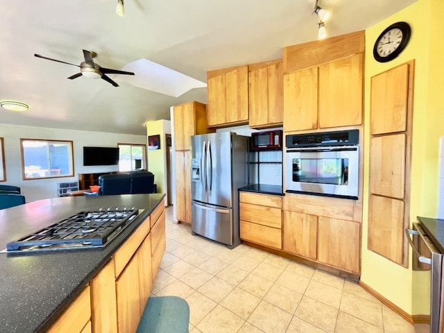 kitchen with ceiling fan, light tile patterned floors, stainless steel appliances, and light brown cabinetry