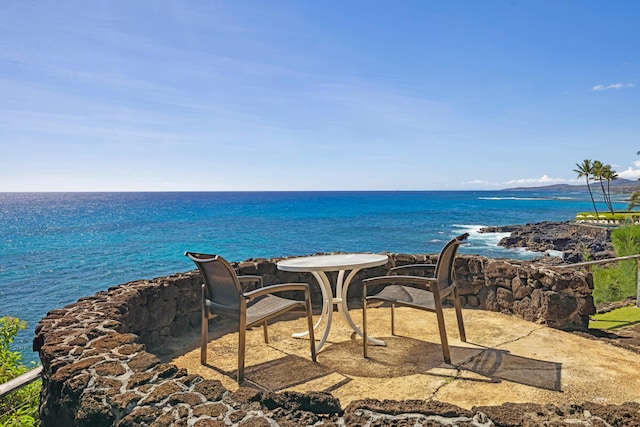 balcony featuring a patio and a water view