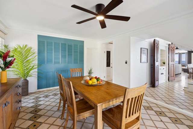 dining space featuring ornamental molding, light tile patterned floors, and ceiling fan