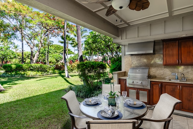 view of patio / terrace featuring ceiling fan, sink, grilling area, and exterior kitchen