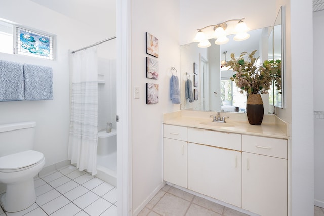 full bathroom featuring vanity, toilet, shower / bath combo with shower curtain, and tile patterned flooring