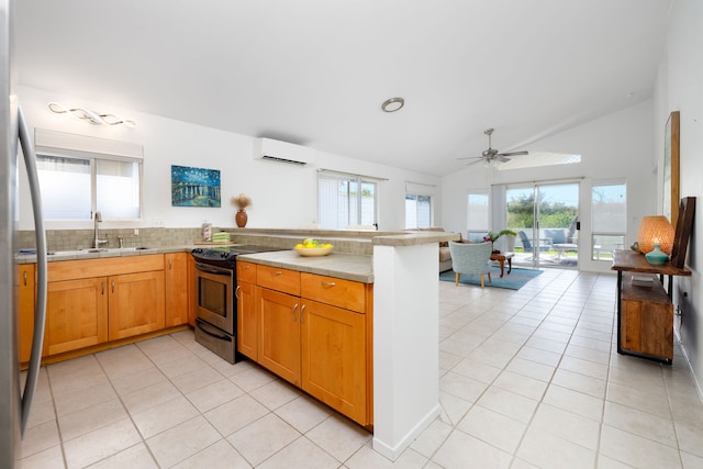 kitchen with sink, black electric range, kitchen peninsula, a wall mounted AC, and lofted ceiling