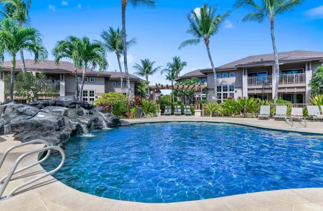 view of swimming pool featuring a patio area and pool water feature