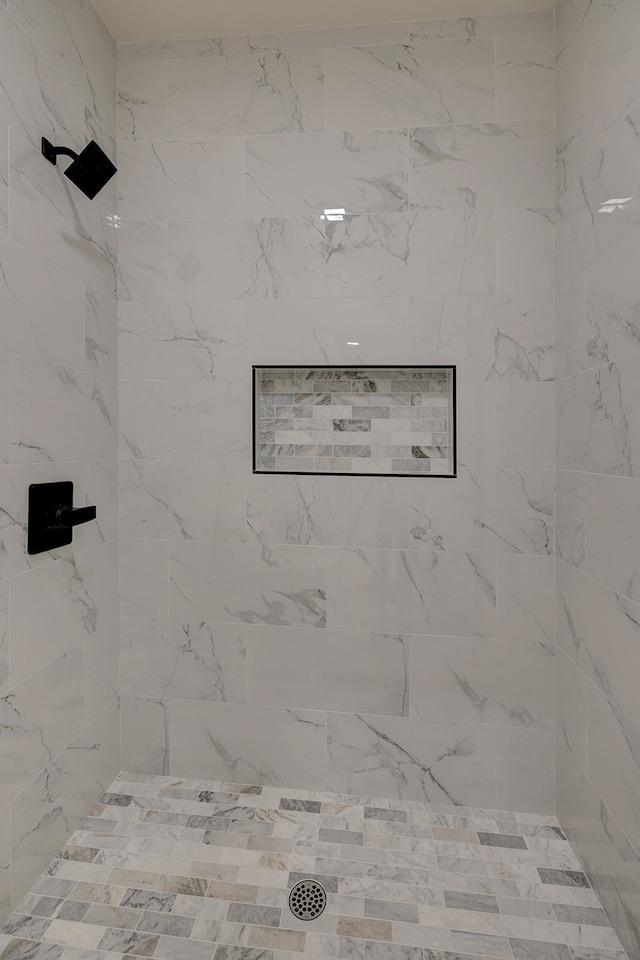 details with a tile shower