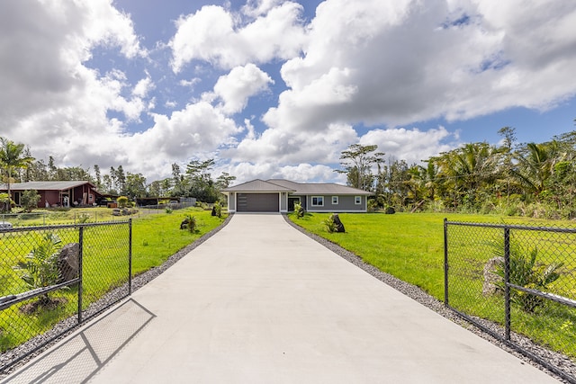 view of front of home with a garage and a front yard