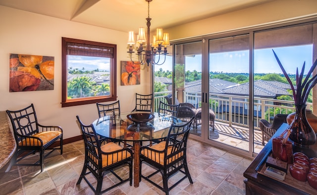 dining area with an inviting chandelier