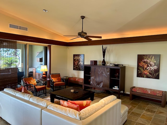 living room with ceiling fan and vaulted ceiling