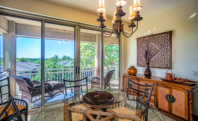 sunroom with a chandelier