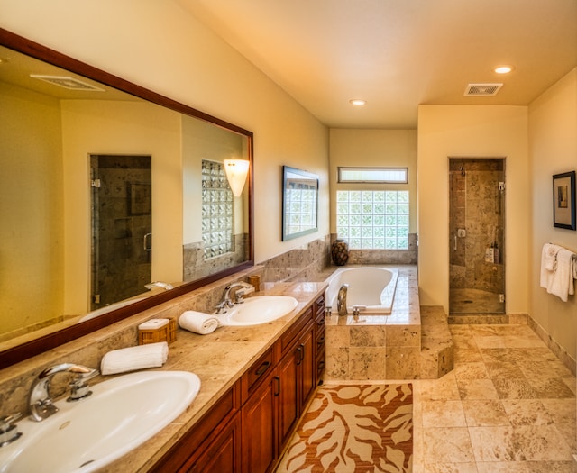 bathroom featuring vanity and plus walk in shower