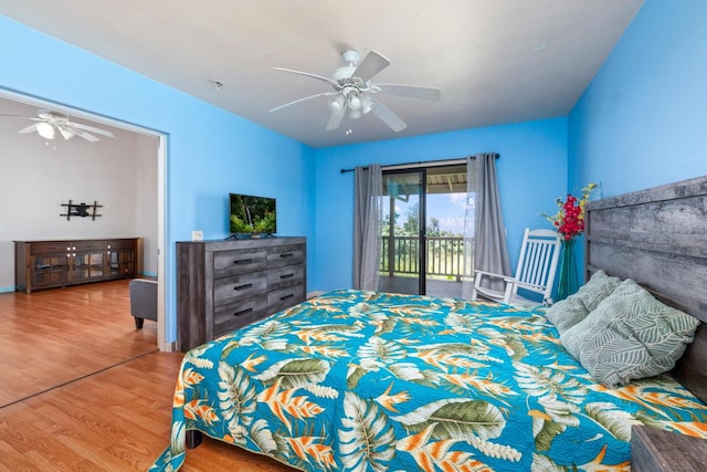 bedroom featuring access to exterior, hardwood / wood-style flooring, and ceiling fan