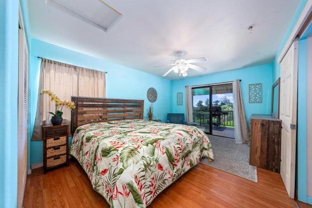 bedroom with access to exterior, ceiling fan, a closet, and wood-type flooring