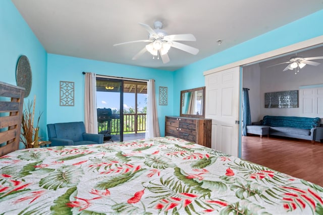 bedroom featuring ceiling fan, dark hardwood / wood-style flooring, and access to exterior