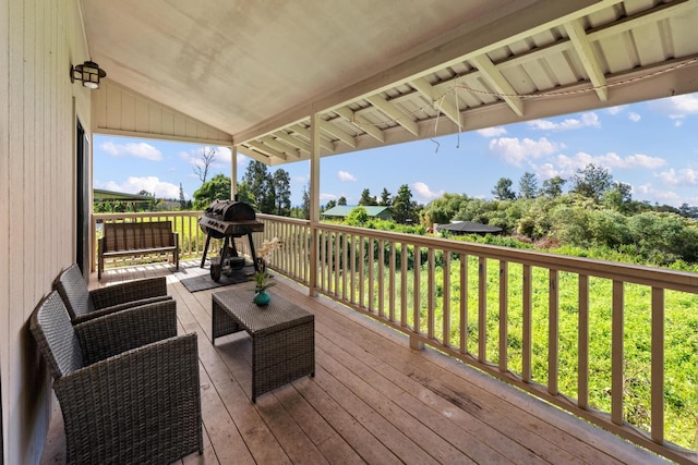 wooden deck featuring area for grilling