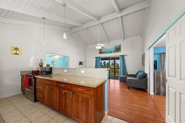 kitchen with electric stove, hanging light fixtures, light wood-type flooring, light stone counters, and kitchen peninsula