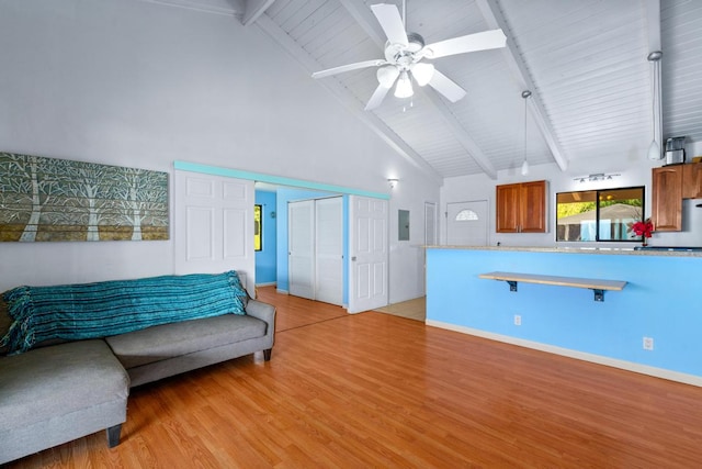 living room with wooden ceiling, high vaulted ceiling, ceiling fan, light wood-type flooring, and beam ceiling