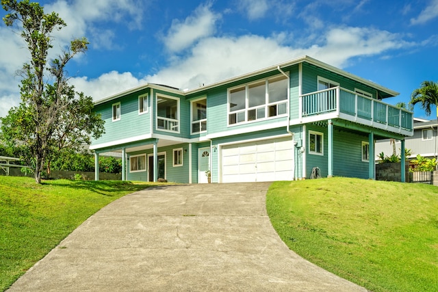 view of front of home featuring a garage and a front lawn