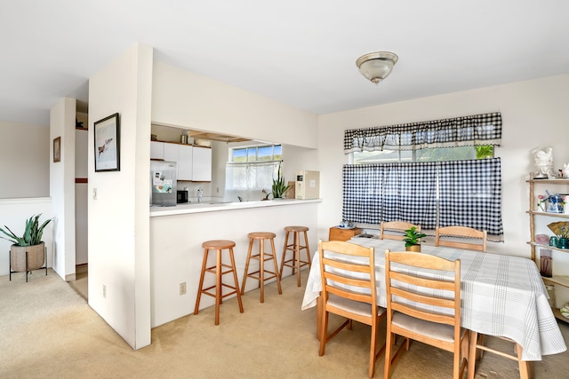 view of carpeted dining space