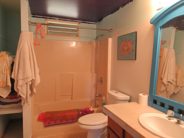 full bathroom with vanity, toilet, tile patterned floors, and  shower combination