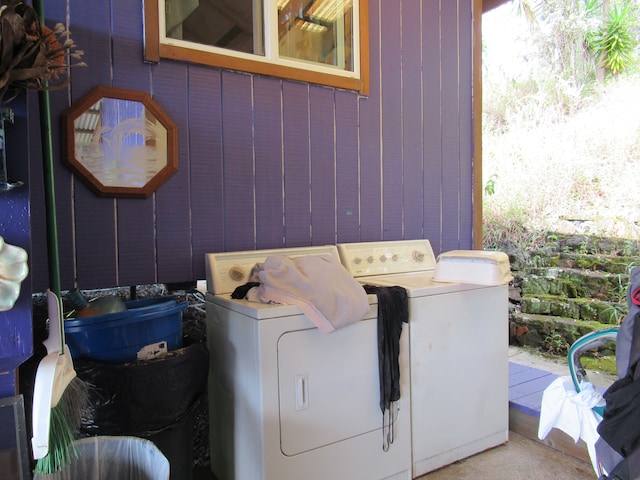 laundry area with independent washer and dryer