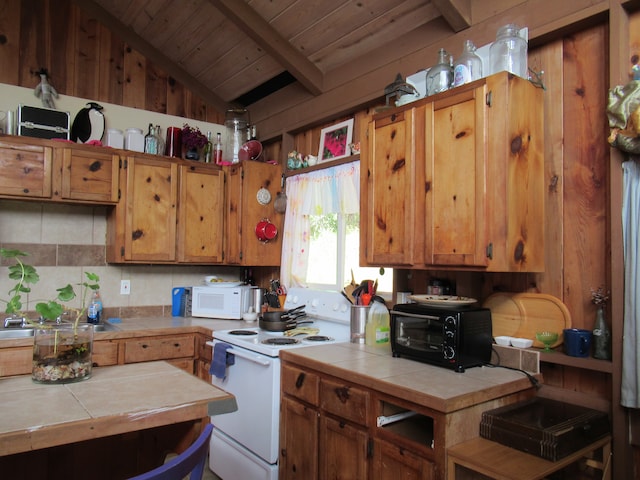 kitchen with vaulted ceiling with beams, tile countertops, wooden ceiling, sink, and white appliances