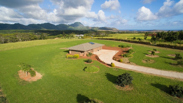 drone / aerial view featuring a mountain view and a rural view