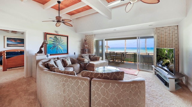 living room featuring a towering ceiling, light colored carpet, ceiling fan, beam ceiling, and wooden ceiling