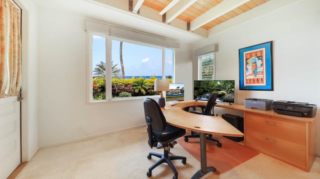 office area with light carpet, beam ceiling, plenty of natural light, and wood ceiling