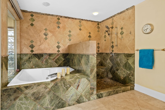 bathroom with a wealth of natural light and separate shower and tub