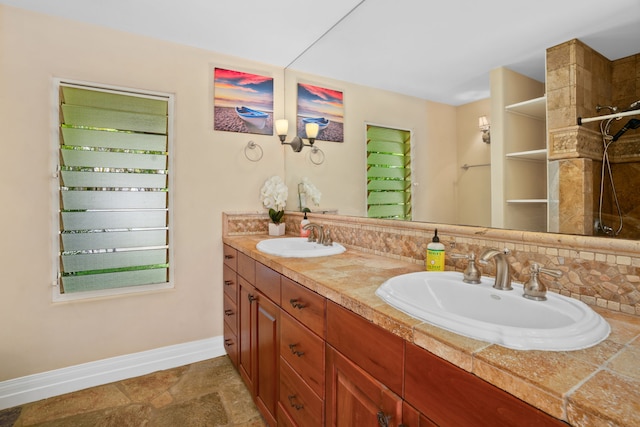 bathroom with vanity and backsplash