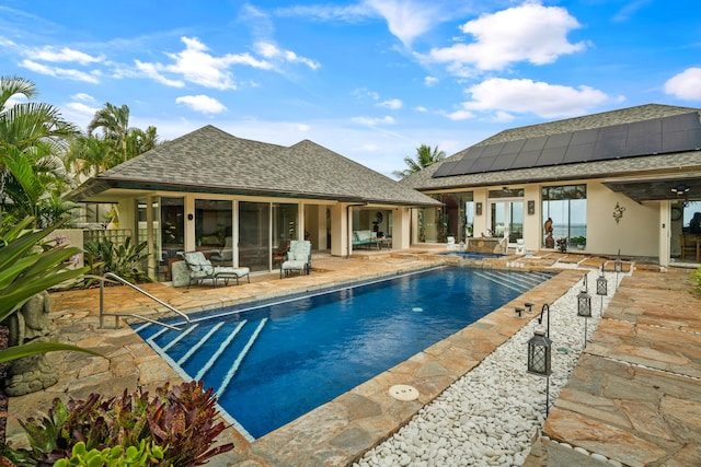 view of swimming pool with a patio