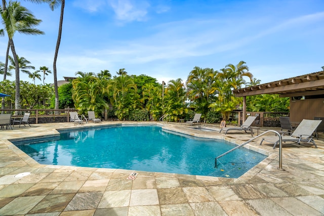 view of swimming pool featuring a pergola and a patio area