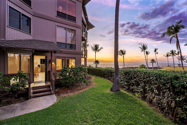 yard at dusk with a water view