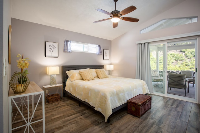 bedroom featuring multiple windows, dark wood-type flooring, vaulted ceiling, and access to exterior