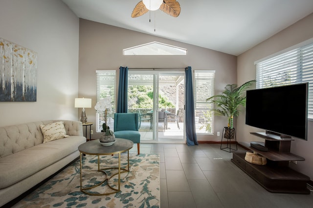 living room featuring high vaulted ceiling, tile patterned floors, ceiling fan, and a healthy amount of sunlight