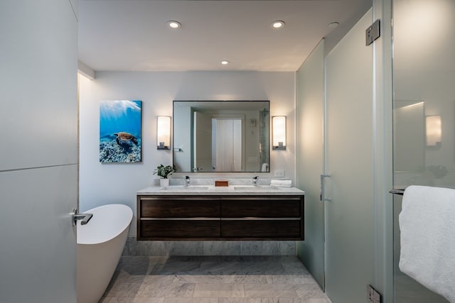 bathroom featuring independent shower and bath and vanity