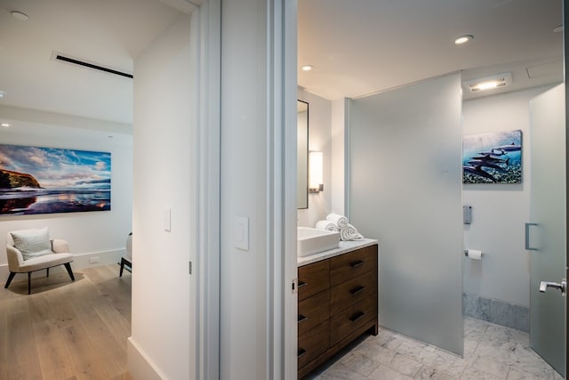 bathroom featuring hardwood / wood-style floors and vanity