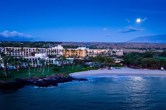 birds eye view of property featuring a view of the beach and a water view