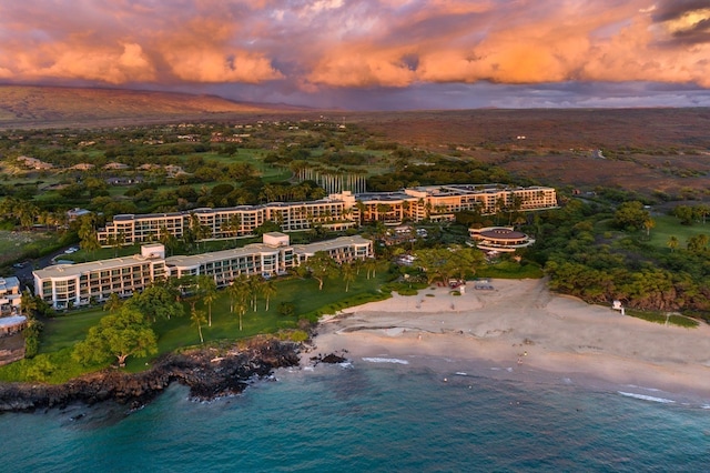 aerial view at dusk with a water view