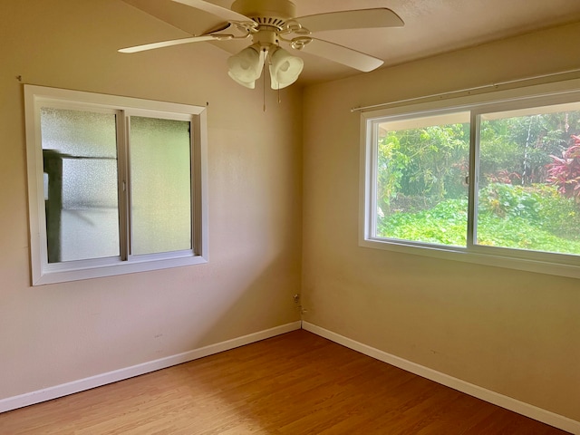 empty room with light wood-type flooring and ceiling fan