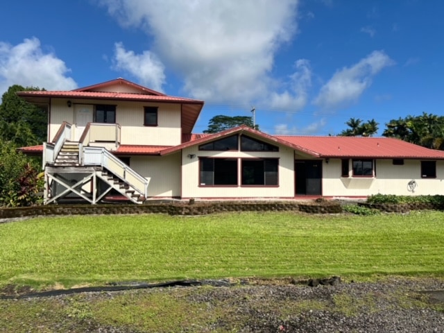 back of house with a yard