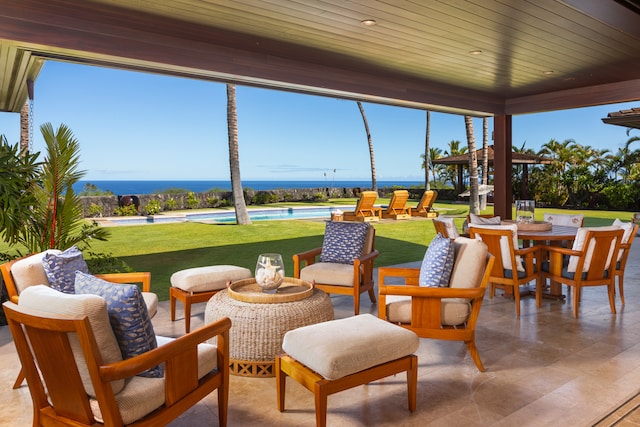 sunroom / solarium featuring wood ceiling and a water view