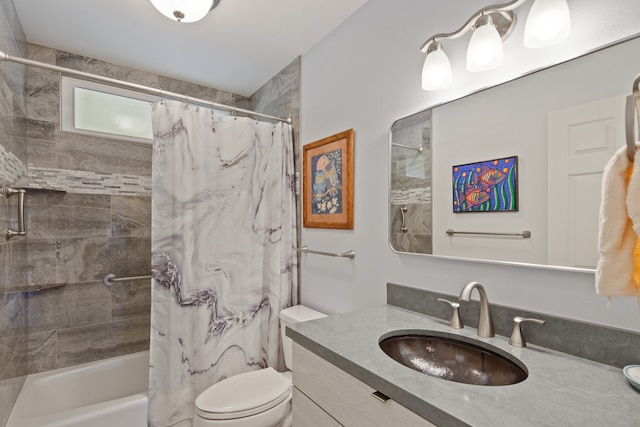 full bathroom featuring vanity, toilet, and shower / bathtub combination with curtain